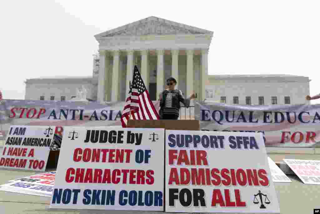 A person protests outside of the Supreme Court in Washington. The Supreme Court struck down affirmative action in college admissions, declaring race cannot be a factor and forcing institutions of higher education to look for new ways to achieve diverse student bodies. 
