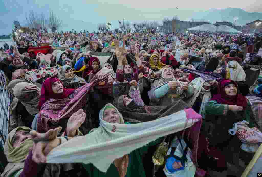Kashmiri Muslims pray as the head priest displays a relic at the Hazratbal shrine on the occasion of Mehraj-u-Alam, believed to mark the ascension of Prophet Muhammad to heaven, in Srinagar, Indian-controlled Kashmir.