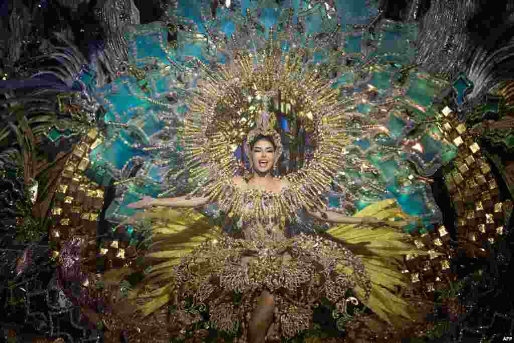 Corina Mrazek Gonzalez presents a design by Santi Castro during the Election of the Queen of Carnival gala in Santa Cruz de Tenrife on the Spanish Canary island of Tenerife, Feb. 7, 2023.