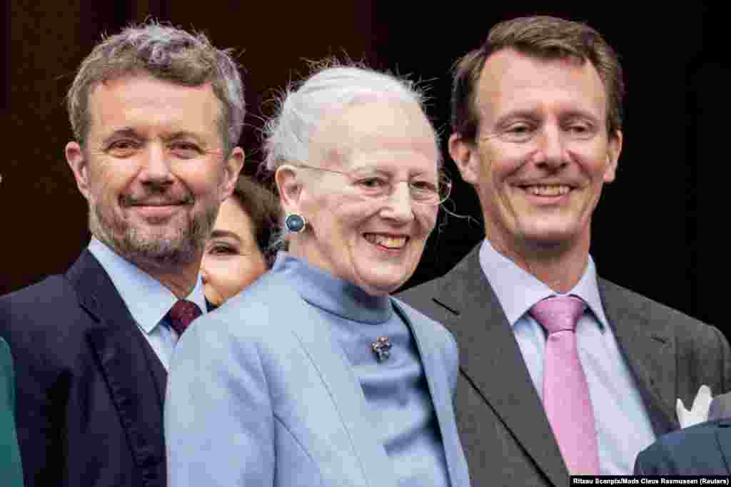 Denmark's Crown Prince Frederik, Queen Margrethe and Prince Joachim react as the Queen celebrates her 83rd birthday at Amalienborg Castle in Copenhagen.