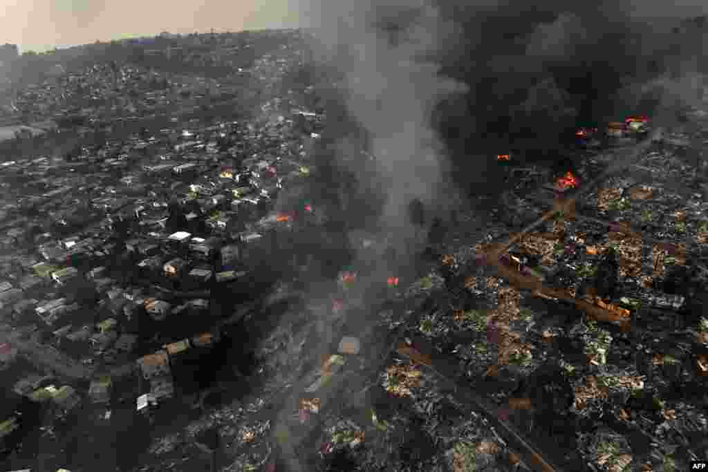 Aerial view of the forest fire that burnt the hills of the city of Viña del Mar in the Las Pataguas sector, Chile, Feb. 3, 2024. The region of Valparaoso and Viña del Mar in central Chile woke up with a partial curfew to allow the movement of evacuees and the transfer of emergency equipment in the midst of a series of unprecedented fires, authorities reported.