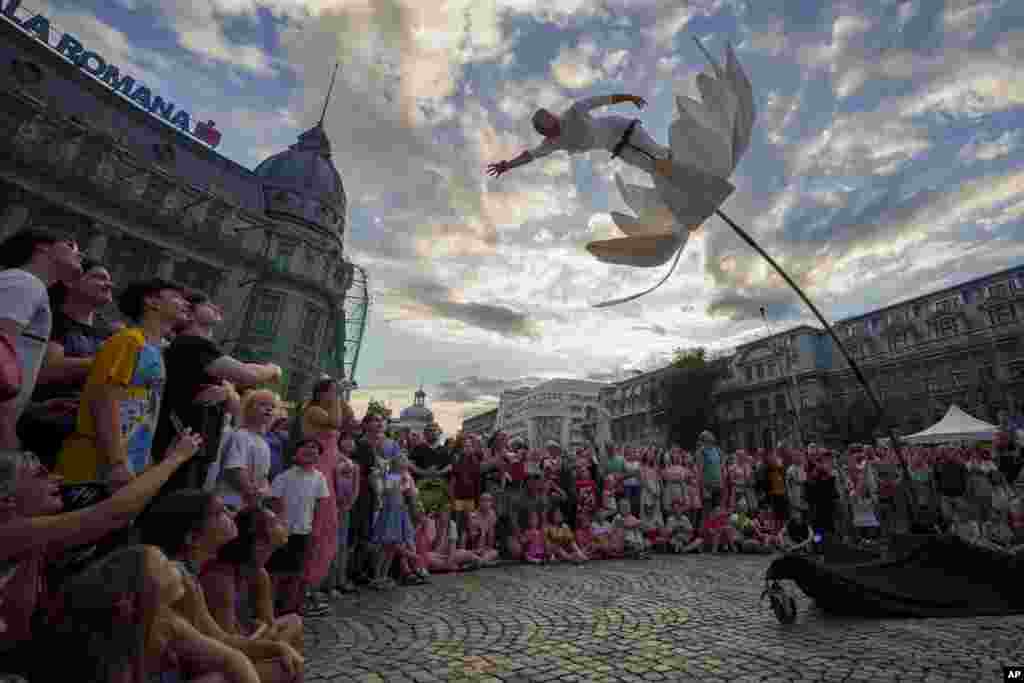 Artists of Italy's Flower Sway Poles perform during the B-FIT in the Street international festival in Bucharest, Romania, July 2, 2023.