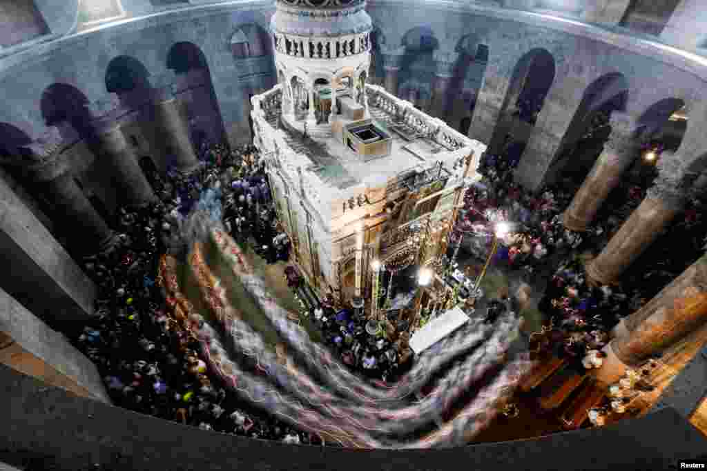 Christian worshipers attend Easter Sunday Mass in the Church of the Holy Sepulchre in Jerusalem's Old City.