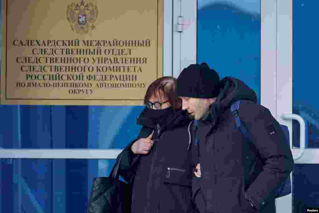 Lyudmila Navalnaya, the mother of late Russian opposition leader Alexei Navalny, and his lawyer Alexei Tsvetkov walk out of an office of the Investigative Committee's regional department in the city of Salekhard in the Yamal-Nenets Region.