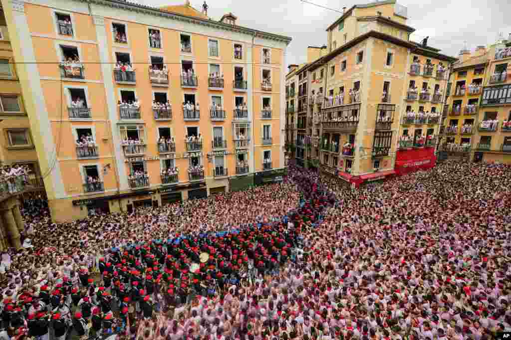 A music band plays in the town hall square after the 'Chupinazo' (start rocket) to mark the official opening of the 2023 San Fermín fiestas in Pamplona, Spain.