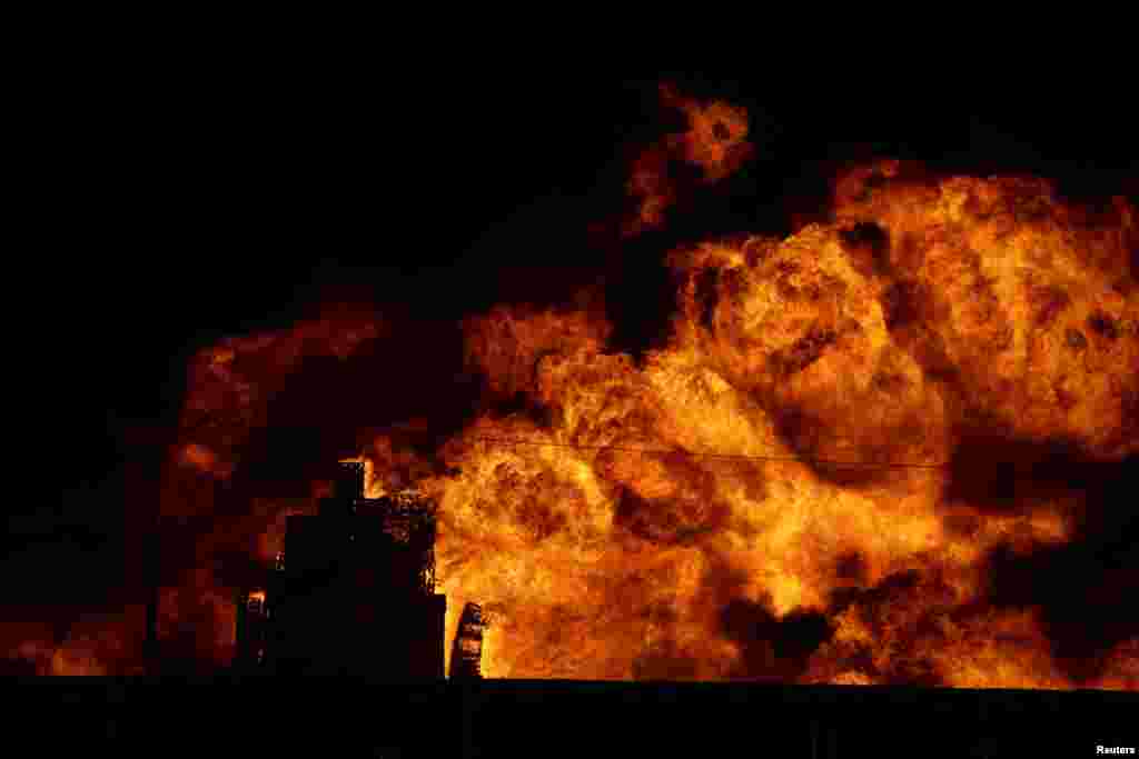 A fire burns at the Central de Abastos wholesale market in Mexico City, Mexico, April 6, 2023.