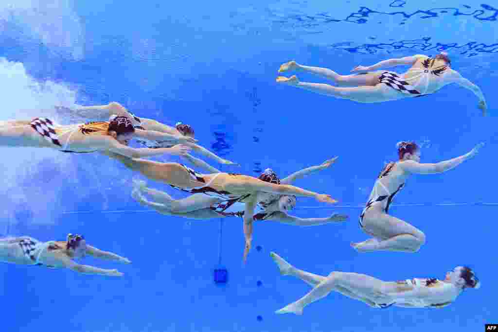 Team Japan competes in the preliminary round of the team free artistic swimming event during the 2024 World Aquatics Championships at Aspire Dome in Doha, Qatar.