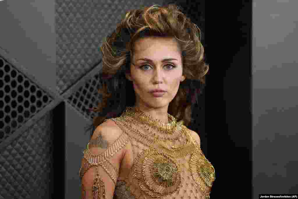 Miley Cyrus arrives at the 66th annual Grammy Awards, Feb. 4, 2024, in Los Angeles, California.