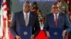 U.S. Secretary of Defense Lloyd Austin, left, and Kenya's Cabinet Secretary for Defense Aden Duale hold copies of a Defense Cooperation Agreement in Nairobi, Kenya, Sept. 25, 2023. 