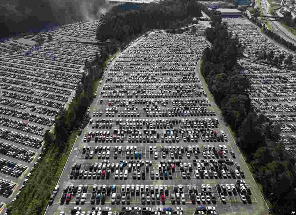 Newly manufactured cars sit parked at the Volkswagen plant in Sao Bernardo do Campo in the greater Sao Paulo area of Brazil, June 28, 2023. The company has temporarily suspended production and scheduled a 10-day collective vacation for its two production shifts starting on July 10 because of they called "market stagnation."