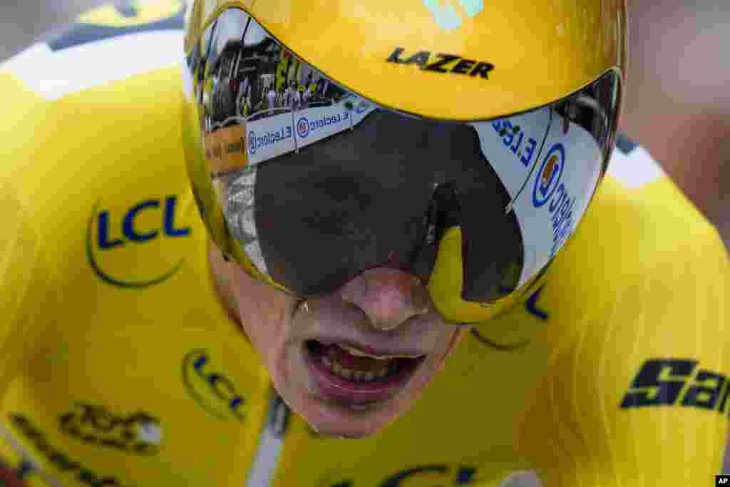 Stage winner and overall leader Denmark's Jonas Vingegaard strains during the sixteenth stage of the Tour de France cycling race, an individual time trial over 22.5 kilometers (14 miles) with start in Passy and finish in Combloux, France. 