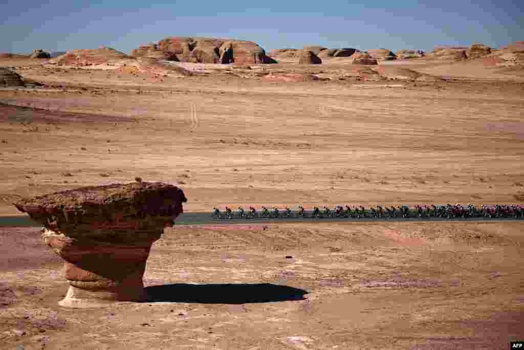 The pack rides during the second stage of al-Ula Tour cycling race near Al-Ula, Saudi Arabia.