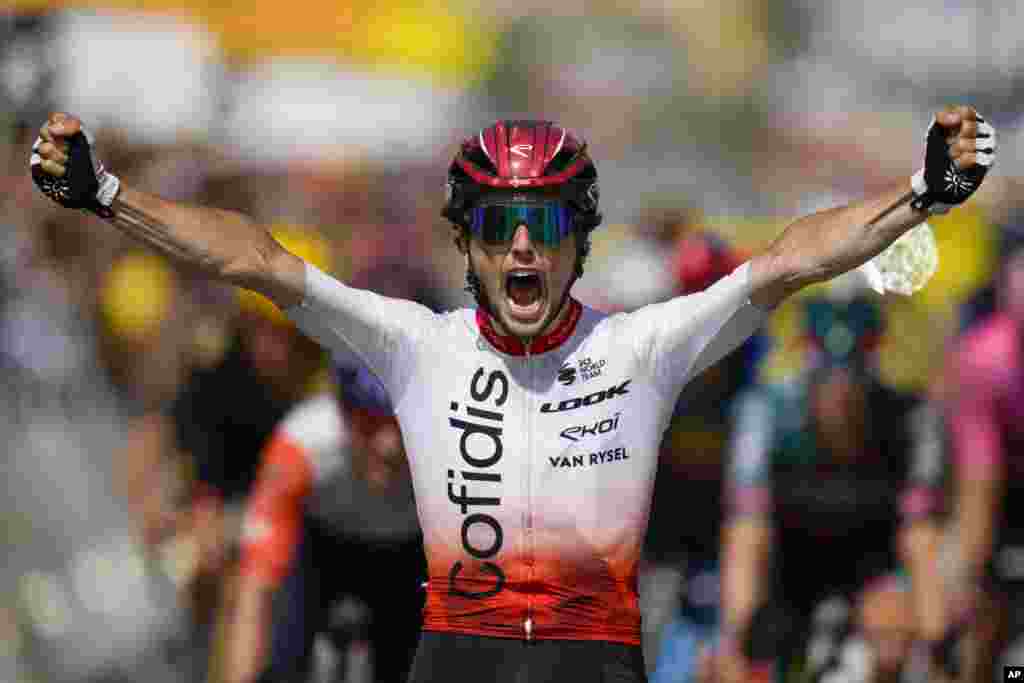 Victor Lafay of France crosses the finish line to win the second stage of the Tour de France cycling race over 209 kilometers (130 miles) with start in Vitoria Gasteiz and finish in San Sebastian, Spain.