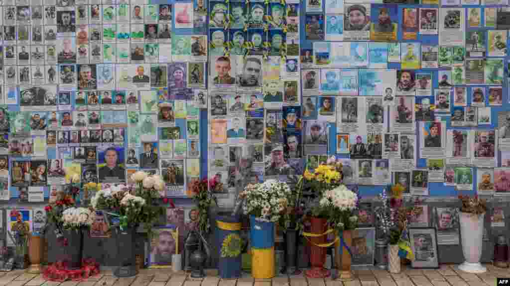 Ahead of the second anniversary of Russia's invasion of Ukraine, "The Wall of Remembrance of the Fallen for Ukraine" stands as a memorial for Ukrainian soldiers in downtown Kyiv.