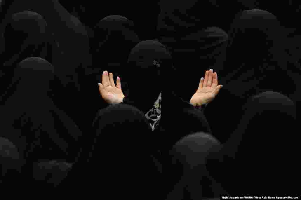 Iranian Shi'ite Muslim women take part in a mourning ritual ahead of Ashura, the holiest day on the Shi'ite Muslim calendar, in Tehran.