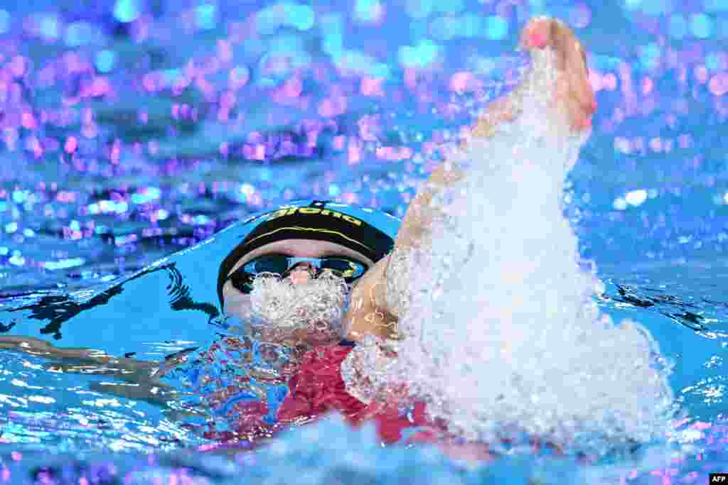 Netherlands' Maaike De Waard competes in a heat of the women's 100m backstroke swimming event during the 2024 World Aquatics Championships at Aspire Dome in Doha, Qatar.