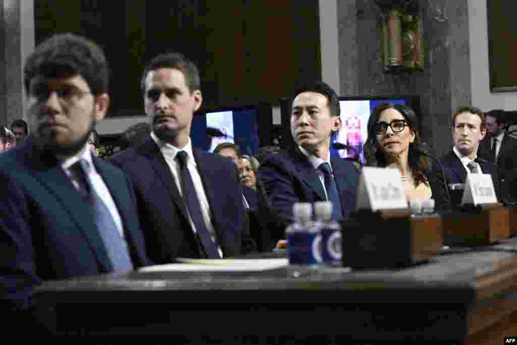 (L-R) Jason Citron, CEO of Discord; Evan Spiegel, CEO of Snap; Shou Zi Chew, CEO of TikTok; Linda Yaccarino, CEO of X; and Mark Zuckerberg, CEO of Meta, watch a video of victims before testifying at the US Senate Judiciary Committee hearing, "Big Tech and the Online Child Sexual Exploitation Crisis," in Washington. 