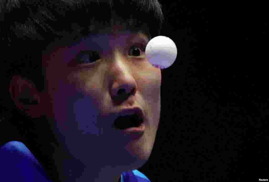 Japan's Tomokazu Harimoto serves the ball to Austria's Andreas Levenko during the ITTF World Team Table Tennis championships Finals in Busan, South Korea.