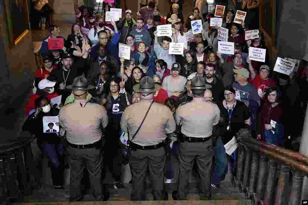 Tennessee State Troopers block the stairwell leading to the legislative chambers, in Nashville. Tennessee Republicans are seeking to oust three House Democrats for using a bullhorn to shout support for pro-gun control protesters in the House chamber.