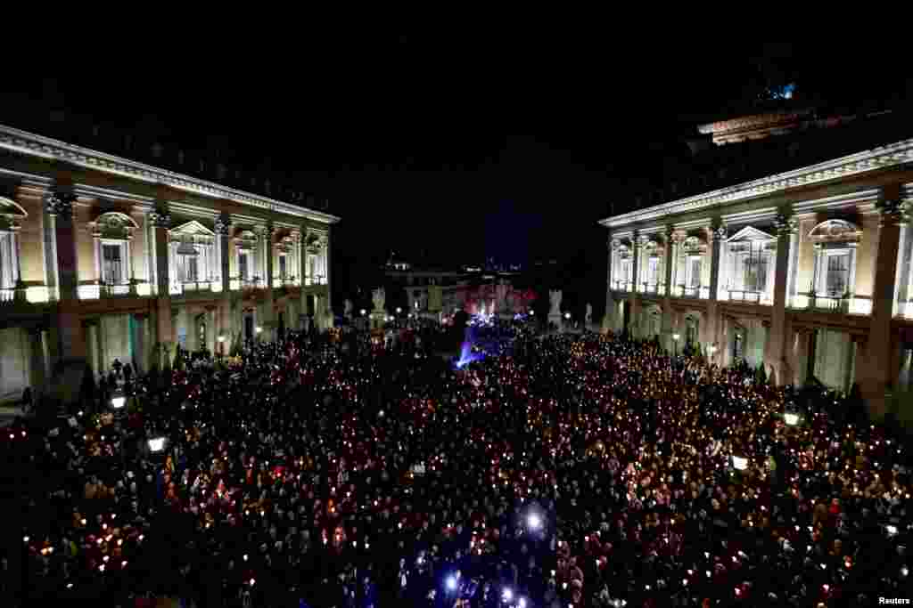 People attend a vigil in memory of late Russian opposition leader Alexei Navalny, at the Campidoglio (Capitoline Hill) in Rome, Italy.