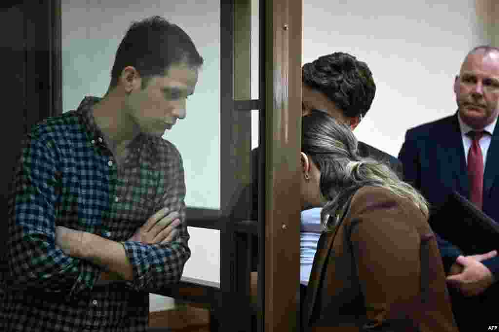 U.S. journalist Evan Gershkovich is seen inside a defendants' cage before a hearing to consider an appeal on his arrest at the Moscow City Court in Moscow, Russia. A Russian court refused to release Gershkovich from jail while he awaits trial on accusations that he spied on Russia while on a reporting assignment last month.