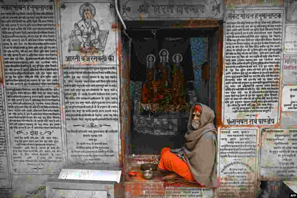 A priest sits at the temple of Hindu god Hanuman, in Ayodhya, India.