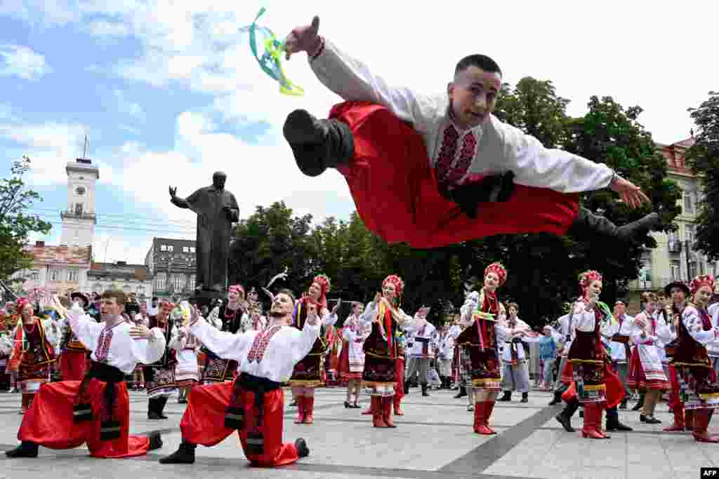 People dance traditional Ukrainian dances during the choreographic performance "Dance of my people" during the celebration of the Ukrainian Constitution Day in Lviv.