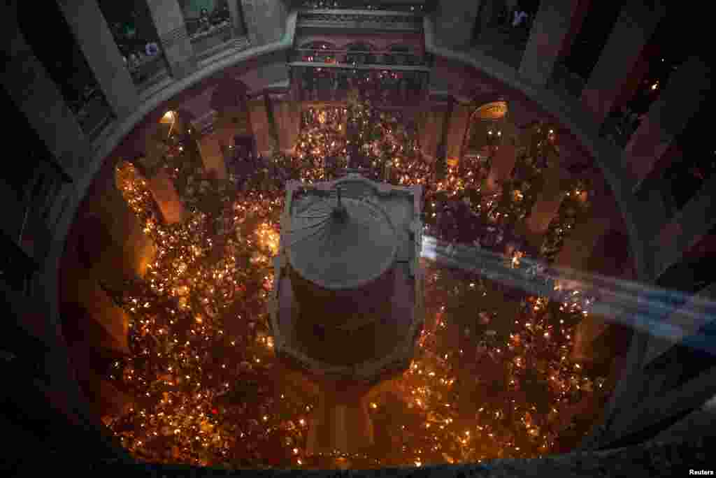 Orthodox Christian worshipers attend the Holy Fire ceremony at the Church of the Holy Sepulchre in Jerusalem's Old City, April 15, 2023.