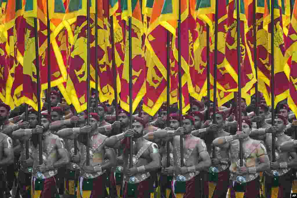 Sri Lankan soldiers march during the country's 76th Independence Day commemoration ceremony in Colombo.