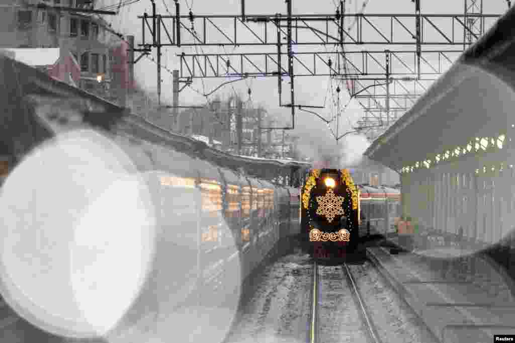 The steam train of Ded Moroz (Father Frost), the Russian equivalent of Santa Claus, traveling all over the country ahead of the New Year, arrives at Belorussky railway station in Moscow, Russia.