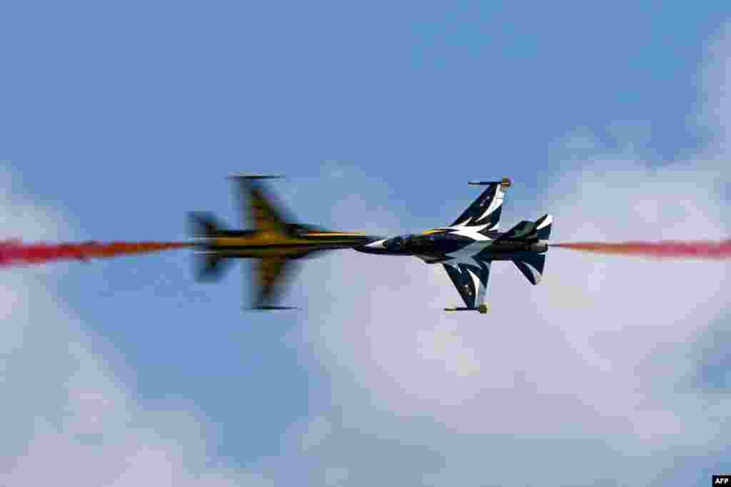Members of South Korea's 'Black Eagle' aerobatics team perform during a preview of the Singapore Airshow in Singapore.