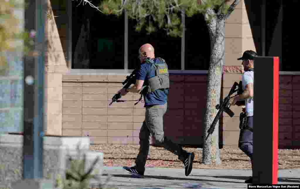 Law enforcement officers head to UNLV campus after reports of an active shooter in Las Vegas, Nevada, Dec. 6, 2023.