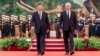 FILE - In this photo released by China's Xinhua News Agency, Chinese President Xi Jinping, left, and Cuba's President Miguel Diaz-Canel Bermudez walk during a welcome ceremony at the Great Hall of the People in Beijing, Nov. 25, 2022.