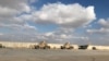 FILE -- Military vehicles of U.S. soldiers are seen at the al-Asad air base in Anbar province, Iraq, January 13, 2020. 