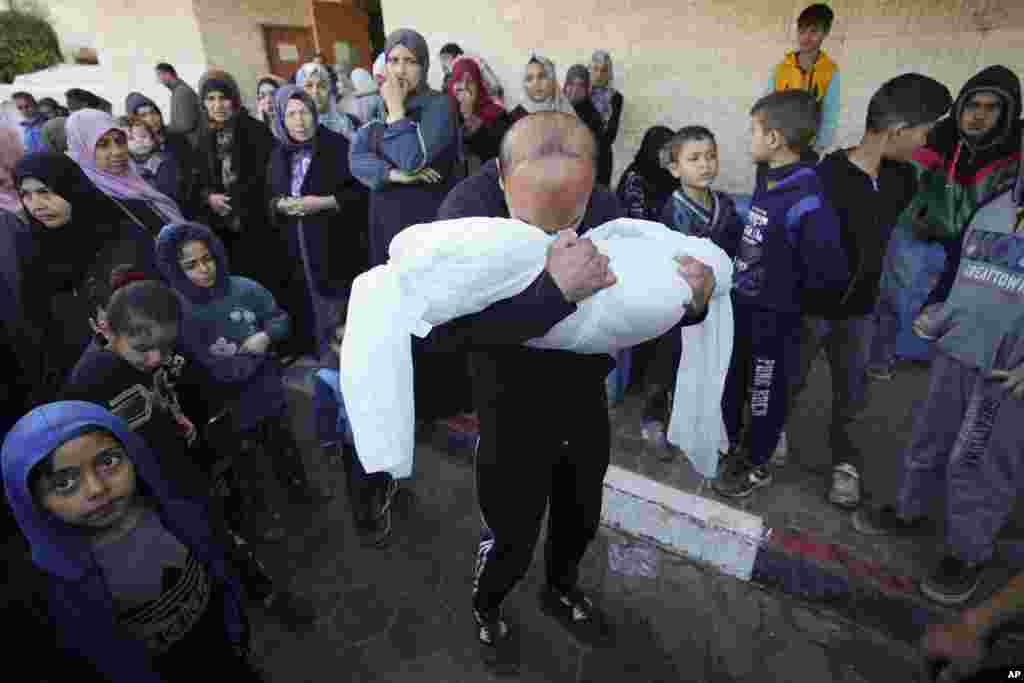 A Palestinian morns a relative killed in the Israeli bombing of the Gaza Strip in Deir al Balah, Gaza Strip.