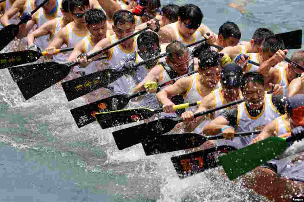 Participants compete in a dragon boat during the annual Tuen Ng or Dragon Boat Festival at Aberdeen fishing port in Hong Kong, China.