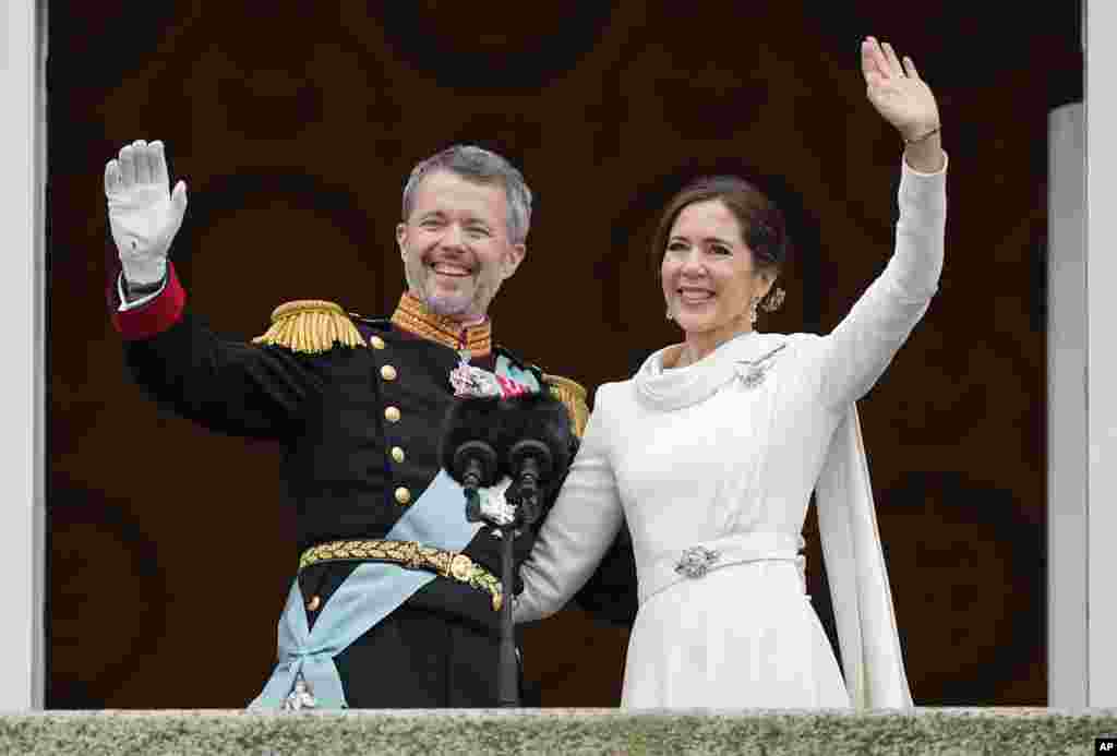 Denmark's King Frederik X and Denmark's Queen Mary wave from the balcony of Christiansborg Palace in Copenhagen. Queen Margrethe II has become Denmark's first monarch to abdicate in nearly 900 years when she handed over the throne to her son, who has become King Frederik X. 