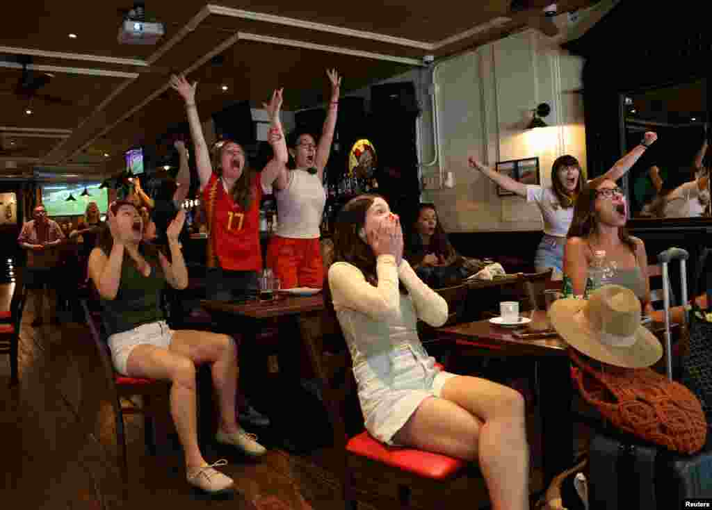 Spain fans celebrate in a bar in Madrid after Spain's Olga Carmona scores their second goal in the semi final match between Spain v Sweden during the FIFA Women's World Cup Australia and New Zealand.