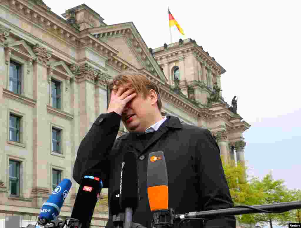 Maximilian Krah, member of the European Parliament for the far-right Alternative for Germany and AfD's top candidate in June's election to the assembly, gives a statement after an aide was arrested on suspicion of espionage for China, in Berlin, Germany.