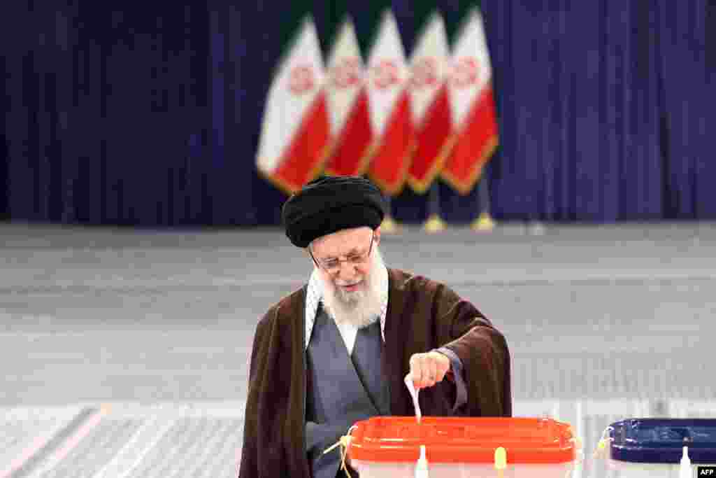 Iran's Supreme Leader Ayatollah Ali Khamenei casts his ballot during the parliamentary and key clerical body elections at a polling station in Tehran.