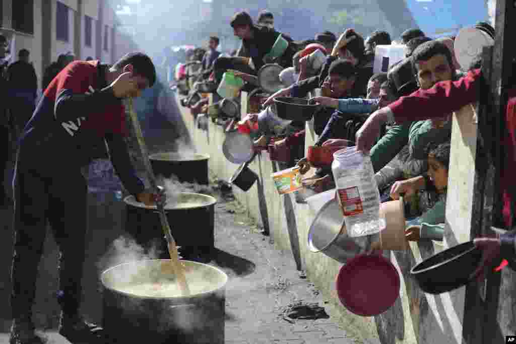 Palestinians line up for a free meal in Rafah, Gaza Strip.
