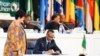 FILE - Rwanda's President Paul Kagame, then chairman of the African Union, signs the African Continental Free Trade Area agreement during the 10th Extraordinary Session of the African Union in Kigali, Rwanda, March 21, 2018. 