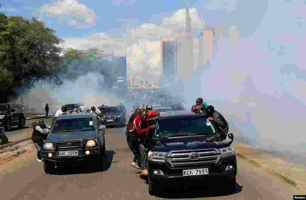 Riot police fire teargas to disperse supporters of Kenya's opposition leader Raila Odinga of the Azimio La Umoja (Declaration of Unity) One Kenya Alliance during a nationwide protest over cost of living and President William Ruto's government in Nairobi.