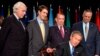 FILE - President George W. Bush signed a $15 billion global AIDS bill May 27, 2003, in Washington. With Bush, from left, were Rep. Tom Lantos, D-Calif., Sen. Bill Frist, R-Tenn., HHS Secretary Tommy Thompson and Secretary of State Colin Powell. 