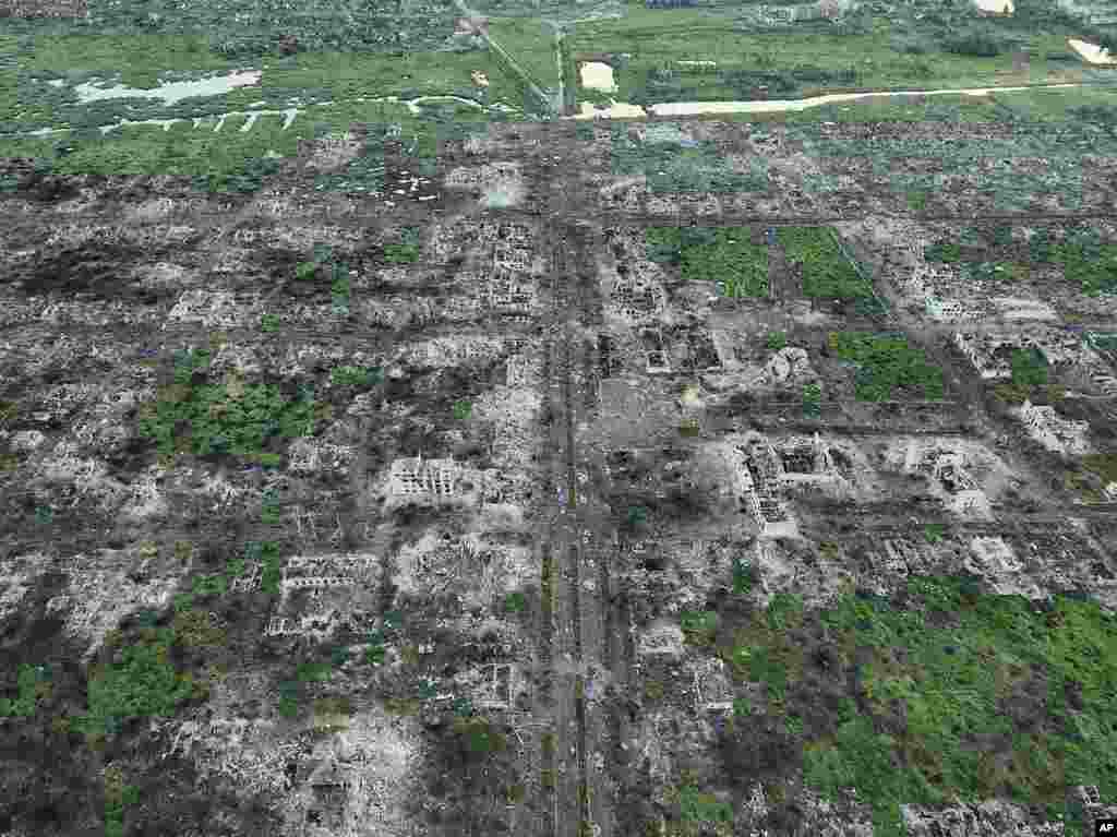 Residential buildings razed to the ground and shell craters are seen on an aerial view of Maryinka, an eastern city where heaviest battles with the Russian troops have been taking place in the Donetsk region, Ukraine.