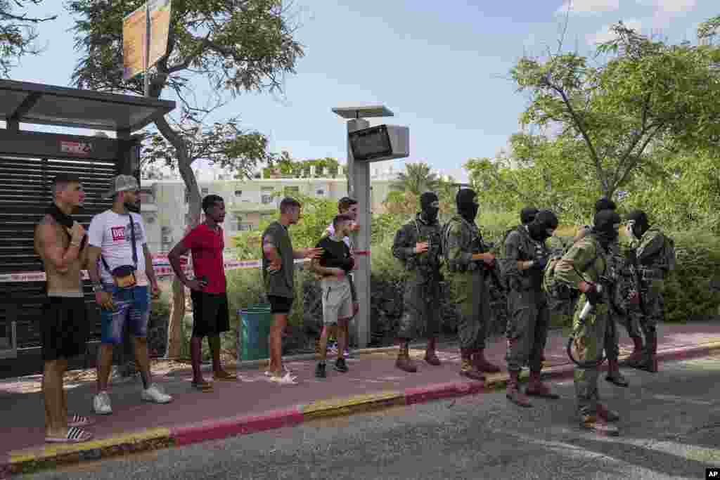 Israeli security forces are seen deployed at the site of a shooting attack in the West Bank Israeli settlement of Maale Adumim. A Palestinian gunman opened fire in an Israeli settlement east of Jerusalem, wounding at least four people, Israeli medics said. 