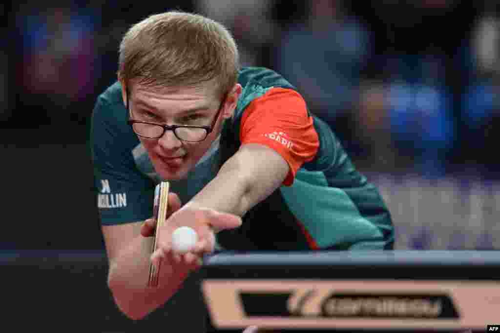 French Felix Lebrun serves to French Simon Gauzy during the men's single semi-final table tennis match in the France 2024 Championship at FDI Stadium in Montpellier, southtern France.
