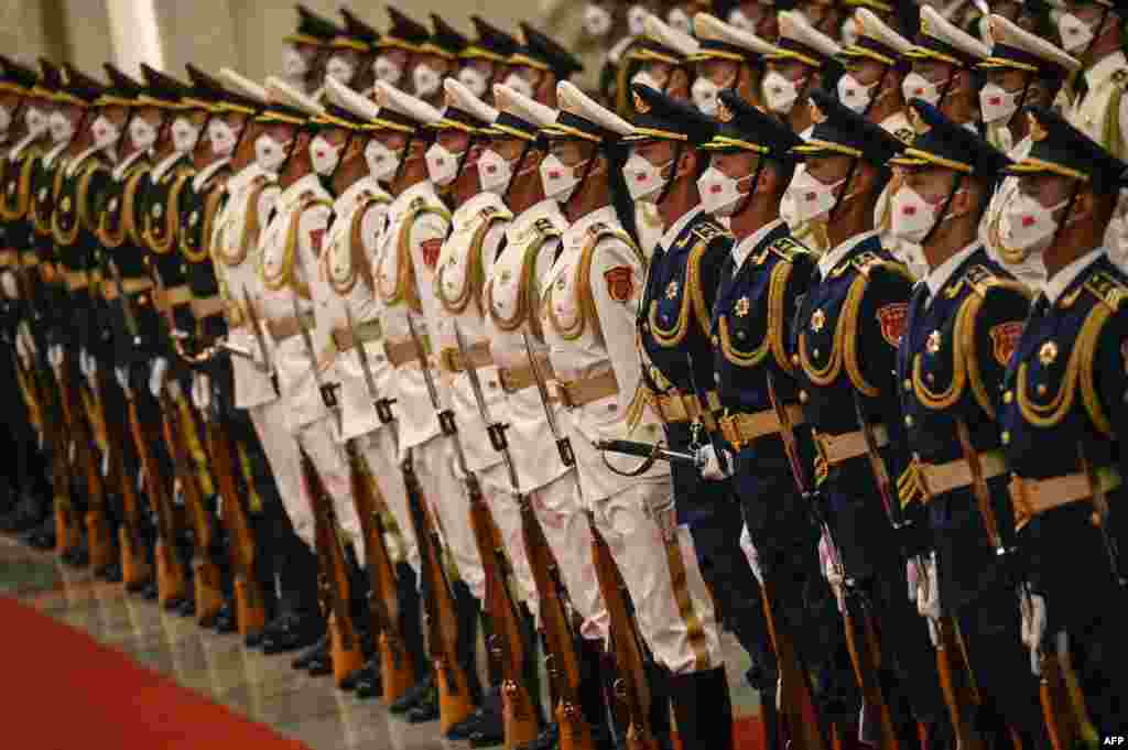 China's honor guard troops prepare for the arrival of President Xi Jinping and Palestinian President Mahmoud Abbas at the Great Hall of the People in Beijing.