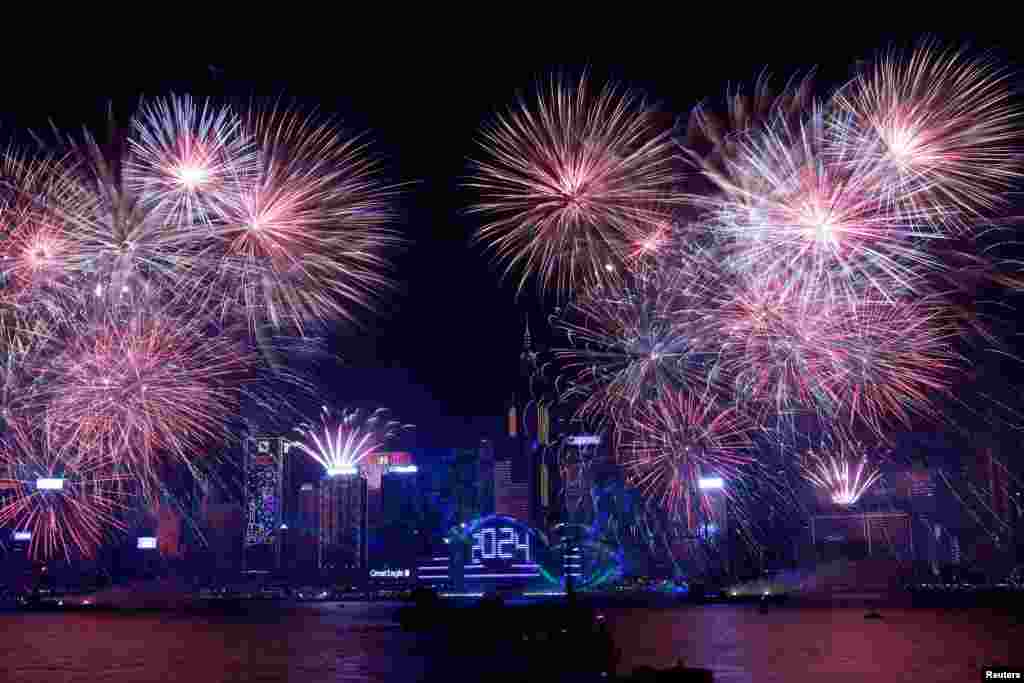 Fireworks explode over Victoria Harbour to celebrate the New Year in Hong Kong, China, Jan. 1, 2024.