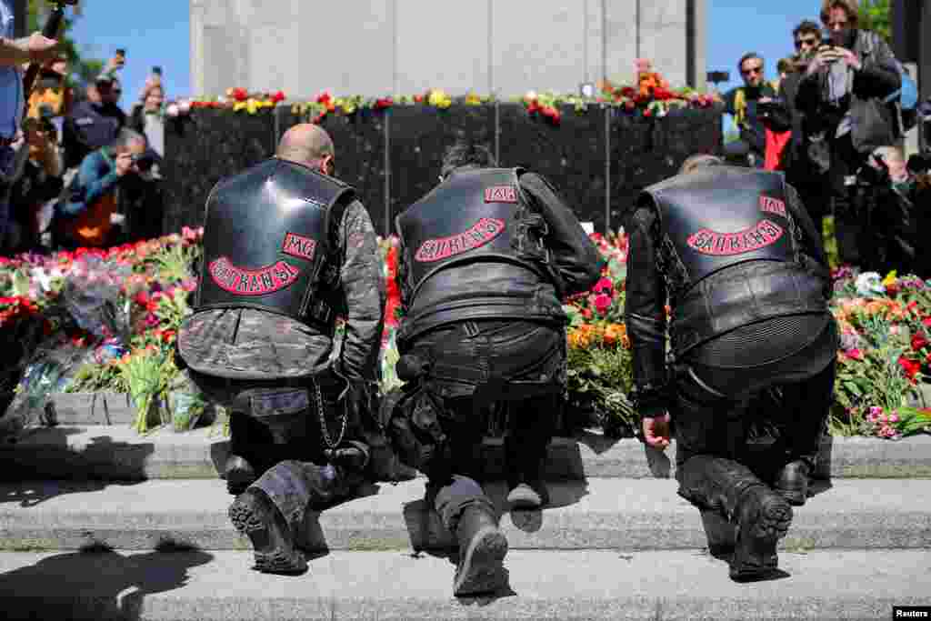 Members of the motorcycling club "Night Wolves" lay flowers to mark Victory Day and the 78th anniversary of the end of World War II in Europe, at the Soviet War Memorial in Tiergarten Park, Berlin, Germany.